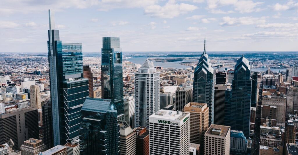 Drone view of modern tall buildings of business centers and offices under tranquil cloudy sky